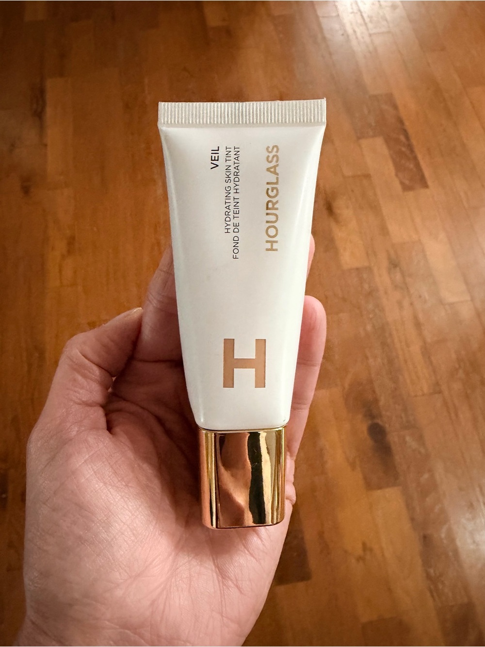 Hourglass Veil Hydrating Skin Tint shade 7 light medium with warm undertones.